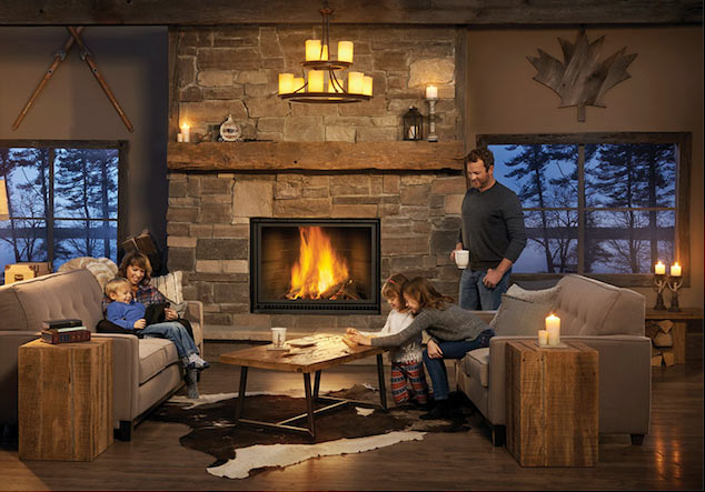 A family enjoying their time with their children in their living room beside a fire place.